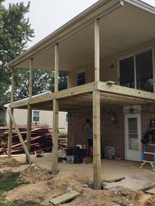 New posts and joist framing beneath the porch roof before decking — Central Pennsylvania