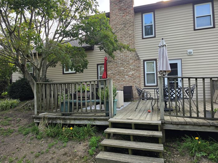 Original weathered wood deck and stairs on the back of the home before replacement — Hampden Township, PA