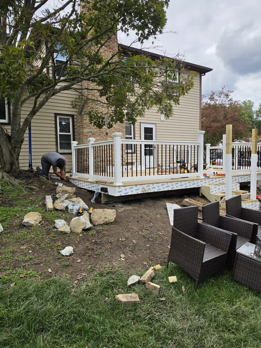 RDI white vinyl railing with black balusters going up on the new composite deck — Hampden Township, PA