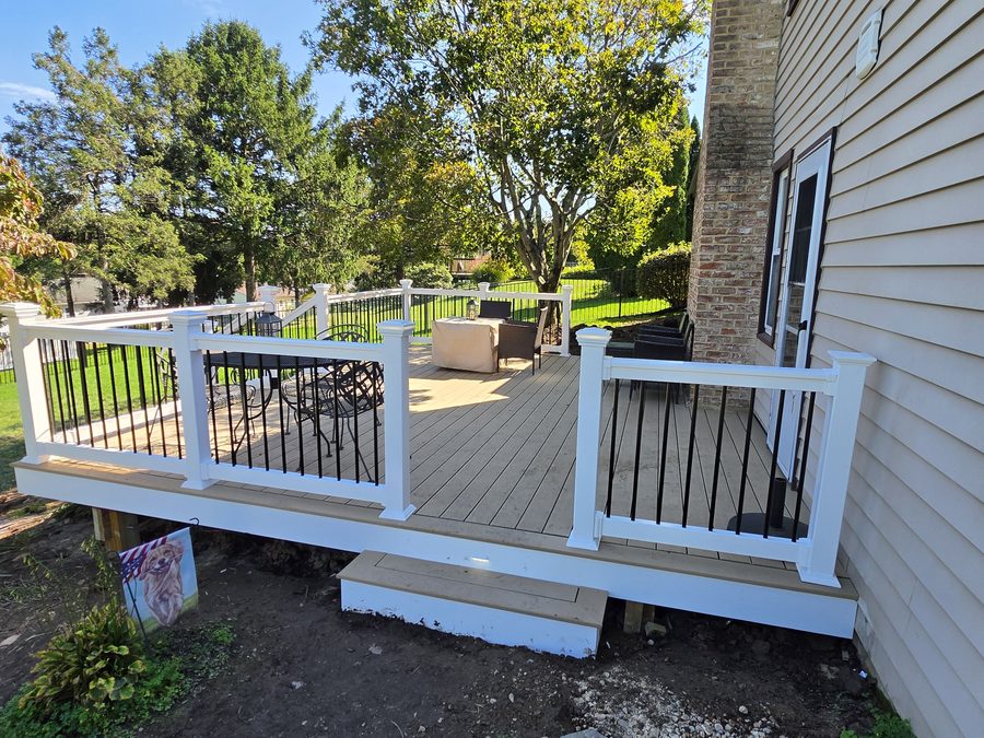 TimberTech Natural White Oak composite deck with RDI white T-Top railing and a step down to the yard — Hampden Township, PA