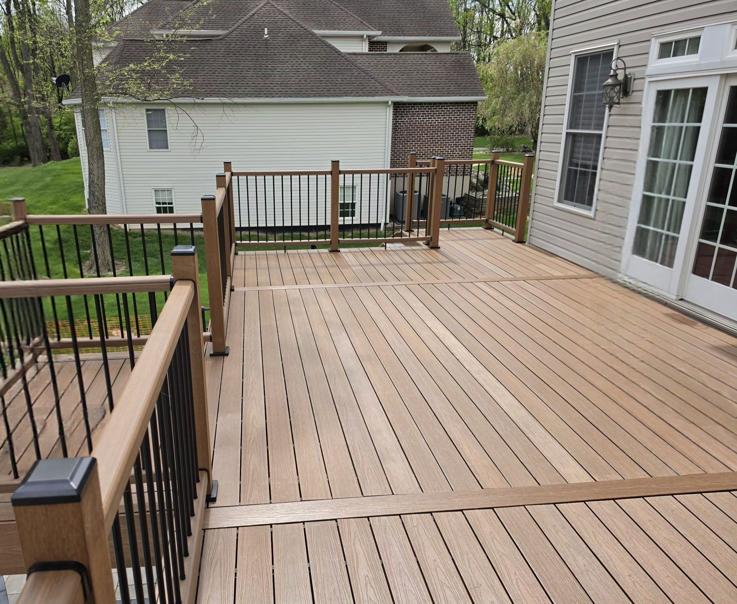 Outdoor living space with custom deck — TrueCraft Decking